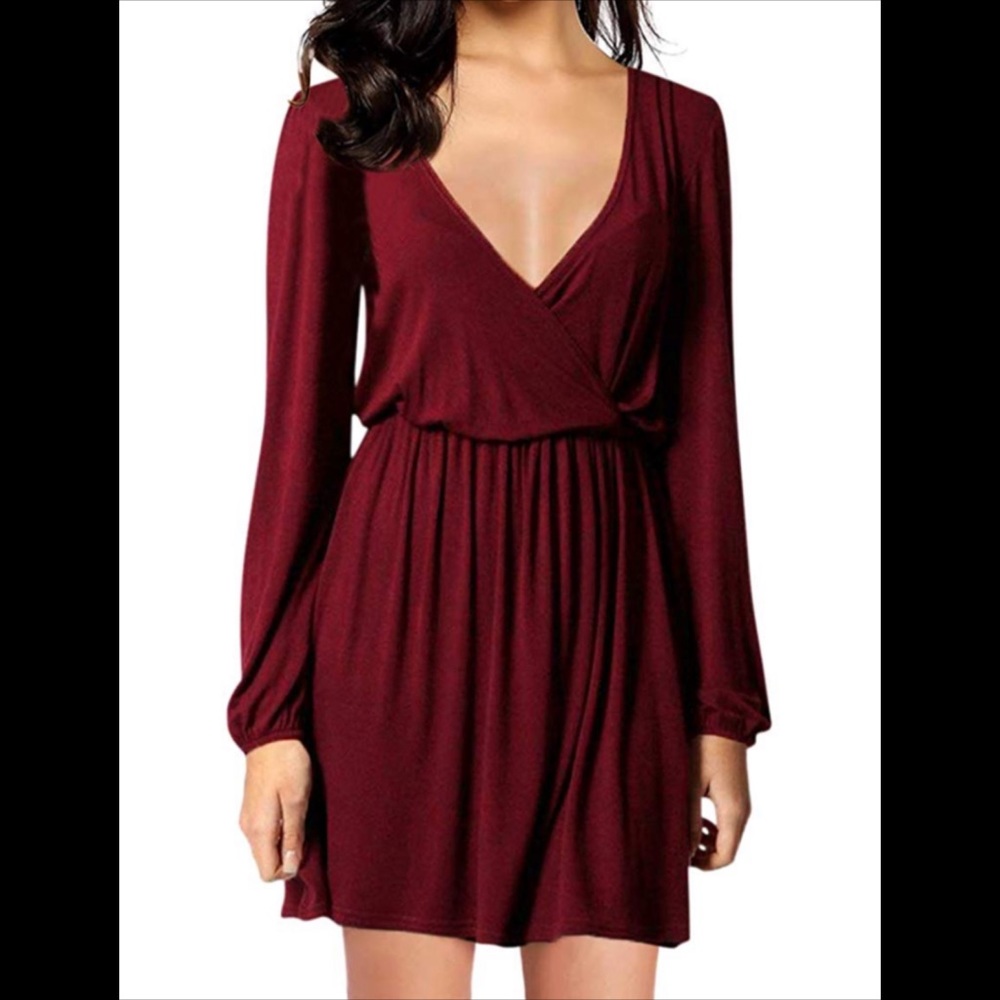 Long sleeved burgundy low cut dress